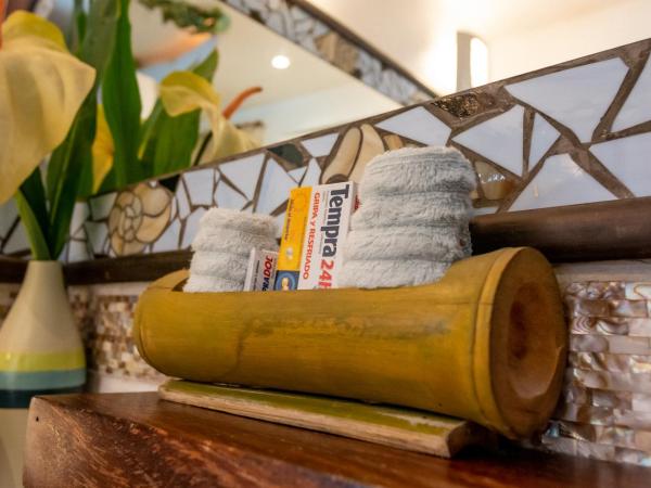 Monyoli Hotel & Boutique : photo 9 de la chambre suite lit king-size avec baignoire spa