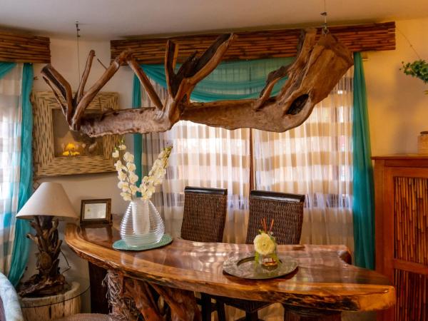 Monyoli Hotel & Boutique : photo 5 de la chambre suite lit king-size avec baignoire spa