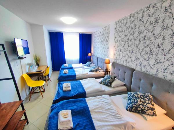 Great Polonia Wrocław City Center : photo 2 de la chambre chambre quadruple