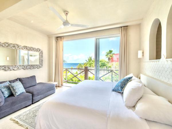 Casa Coco by Coco B Isla : photo 2 de la chambre suite lit king-size - vue partielle sur océan