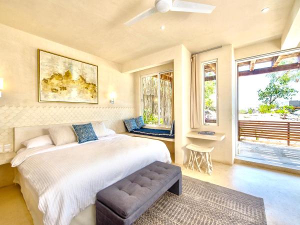 Casa Coco by Coco B Isla : photo 6 de la chambre suite lit king-size - vue partielle sur océan