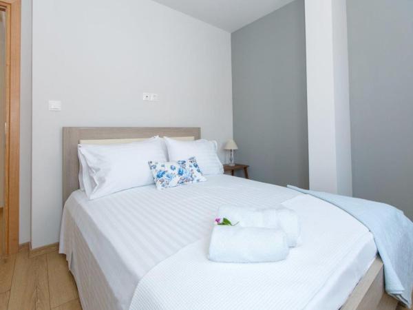 ΟNIRO Comfort Living : photo 9 de la chambre chambre quadruple avec salle de bains privative