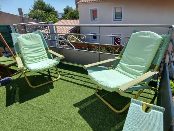 Chambre d'hôte Fleur de Potager : photo 1 de la chambre chambre triple avec terrasse