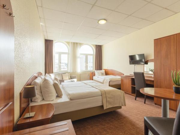 Novum Hotel Hamburg Stadtzentrum : photo 1 de la chambre chambre quadruple confort