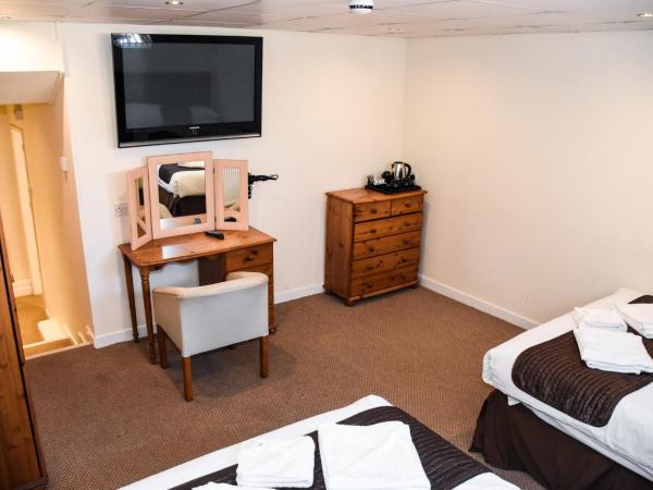 Stuart hotel : photo 8 de la chambre chambre quadruple avec baignoire