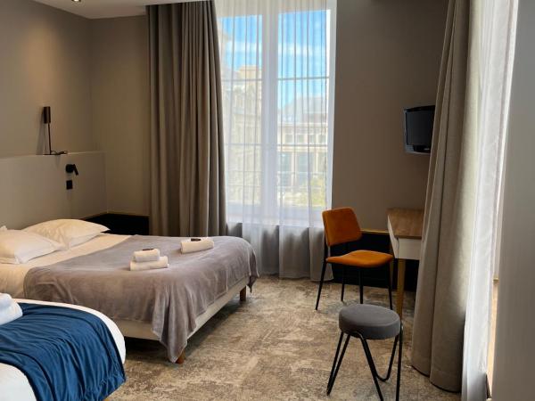 Hotel Brasserie Armoricaine : photo 1 de la chambre chambre triple