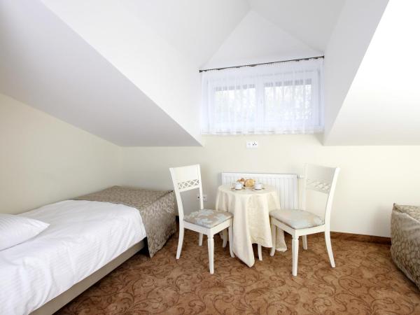Lawendowy Dworek : photo 8 de la chambre chambre lits jumeaux