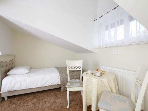 Lawendowy Dworek : photo 10 de la chambre chambre lits jumeaux