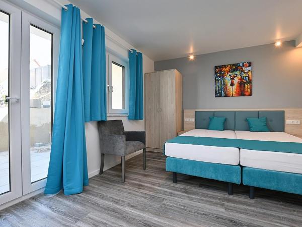 City-Hotel Zuffenhausen : photo 1 de la chambre studio avec terrasse