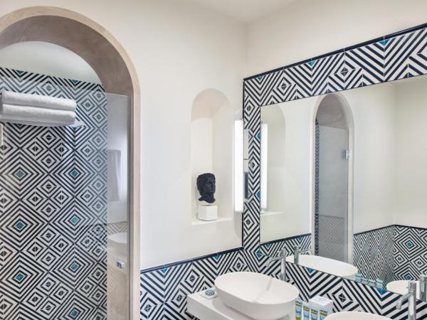 Pazziella Garden & Suites : photo 4 de la chambre chambre quadruple prestige avec vue sur le jardin