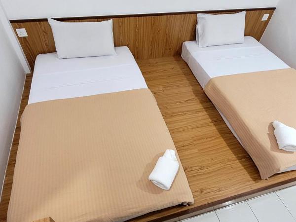 Api-Api GuestHouse : photo 2 de la chambre chambre lits jumeaux standard