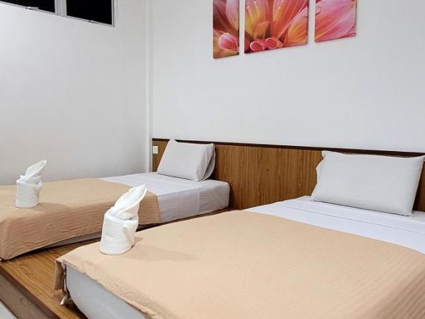 Api-Api GuestHouse : photo 4 de la chambre chambre lits jumeaux standard