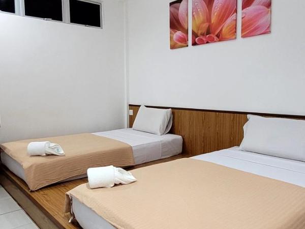 Api-Api GuestHouse : photo 8 de la chambre chambre lits jumeaux standard