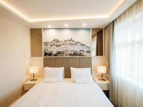 Lábasház Debrecen : photo 2 de la chambre chambre lit king-size