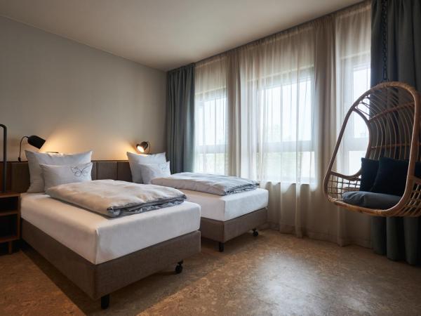 Cocoon Salzburg : photo 1 de la chambre chambre lits jumeaux pour personnes à mobilité réduite