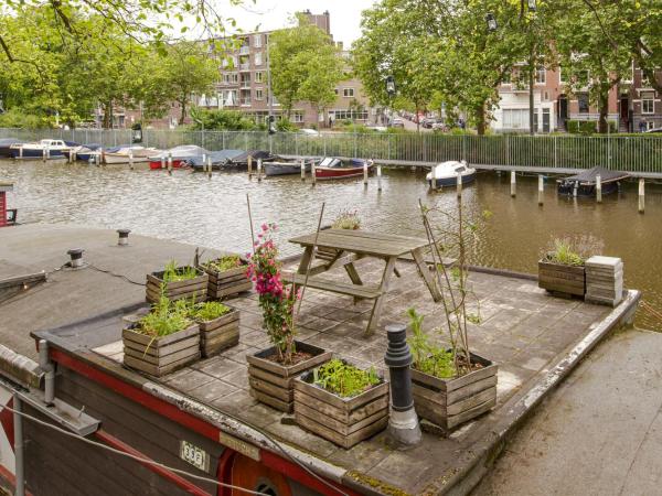 The Amsterdam Houseboat Family - de Jordaan : photo 9 de la chambre ce petit studio est aménagé sur la péniche.