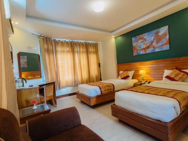 Hotel Tulsi : photo 9 de la chambre chambre deluxe double ou lits jumeaux