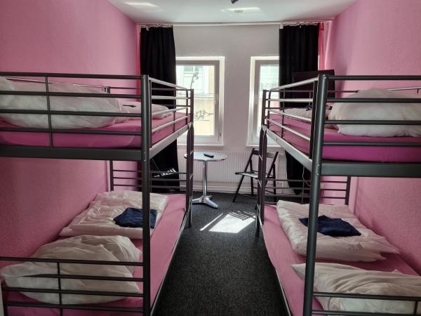 Paulibude : photo 2 de la chambre chambre quadruple avec salle de bains commune