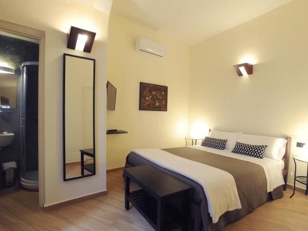 Negramaro Suite B&B : photo 3 de la chambre deux chambres doubles communicantes avec 2 salles de bains