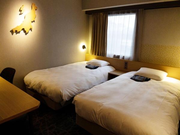 HOTEL GLOBAL VIEW Niigata : photo 1 de la chambre chambre lits jumeaux - non-fumeurs