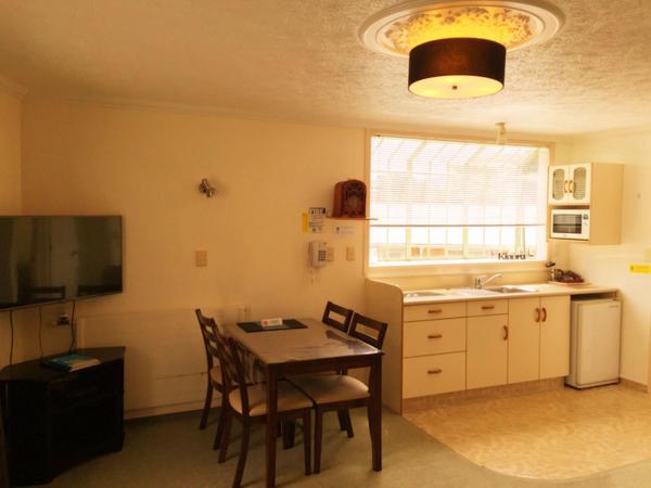 Rotorua Coachman Spa Motel : photo 4 de la chambre suite confort avec bain à remous