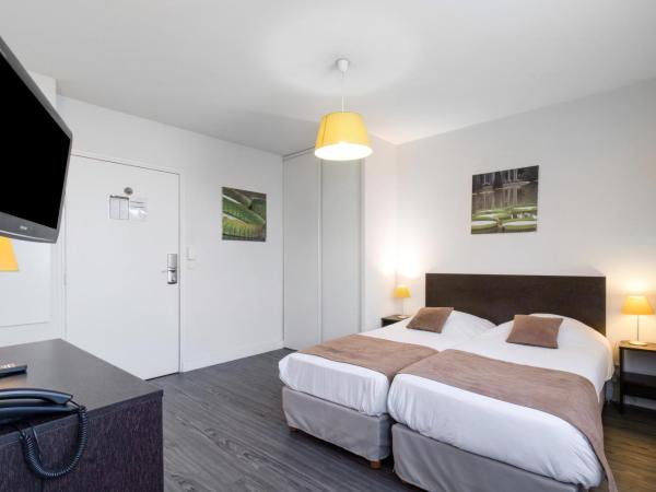 All Suites Pau - Zénith : photo 1 de la chambre studio (1-2 adultes) avec 2 lits simples