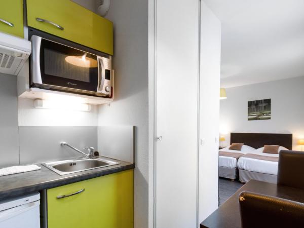 All Suites Pau - Zénith : photo 2 de la chambre studio (1-2 adultes) avec 2 lits simples