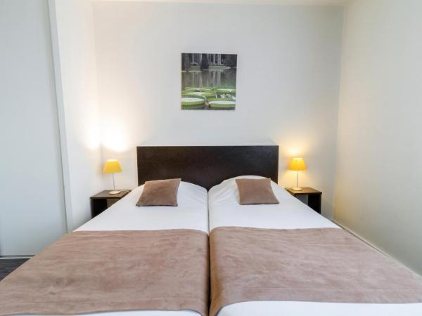 All Suites Pau - Zénith : photo 6 de la chambre studio (1-2 adultes) avec 2 lits simples