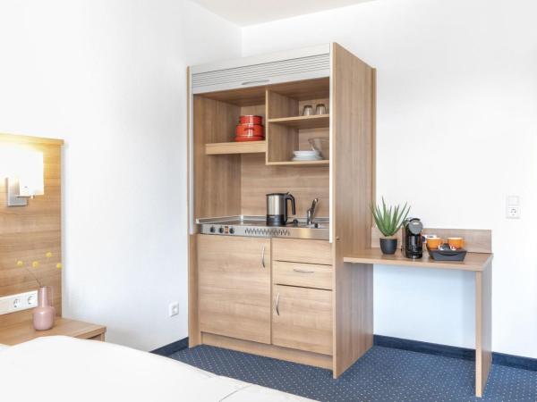 acora Düsseldorf Living the City - Apartments : photo 2 de la chambre appartement supérieur