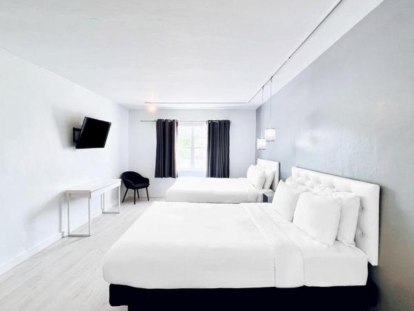 North Beach Hotel : photo 1 de la chambre chambre de luxe avec 2 lits queen-size