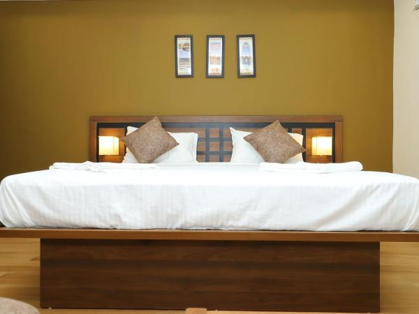 KANS ONE - Madipakkam : photo 5 de la chambre chambre lit king-size