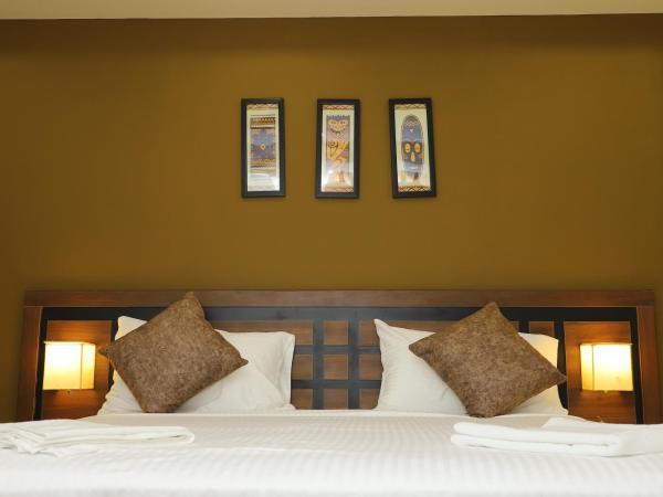 KANS ONE - Madipakkam : photo 4 de la chambre chambre lit king-size