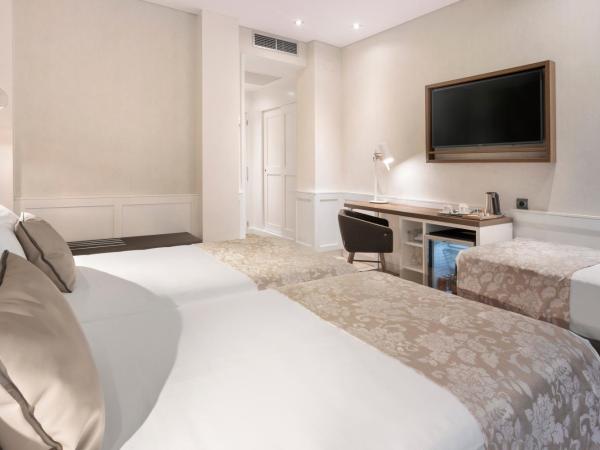 Catalonia Puerta del Sol : photo 3 de la chambre chambre triple