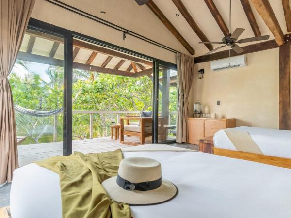 Villa Pescadores Tulum : photo 1 de la chambre chambre deluxe avec 2 lits doubles