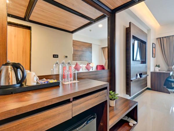 Hotel Tip Top International Pune : photo 9 de la chambre hébergement lit king-size supérieur