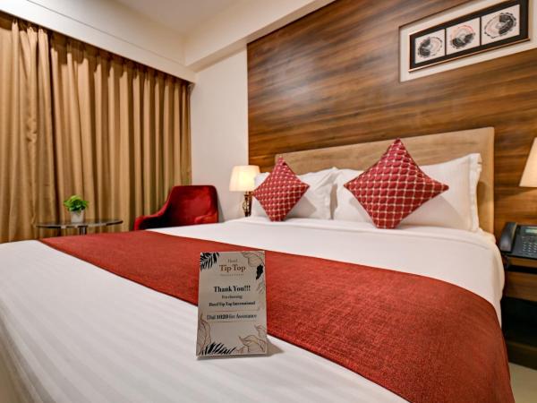 Hotel Tip Top International Pune : photo 10 de la chambre hébergement lit king-size supérieur