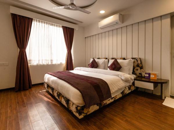 3 BY OYO Nami Residency Ahmedabad : photo 2 de la chambre chambre triple confort avec douche