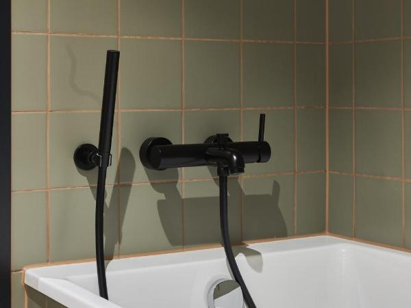 Cocoon Salzburg : photo 3 de la chambre chambre lits jumeaux avec baignoire (lits jumeaux)