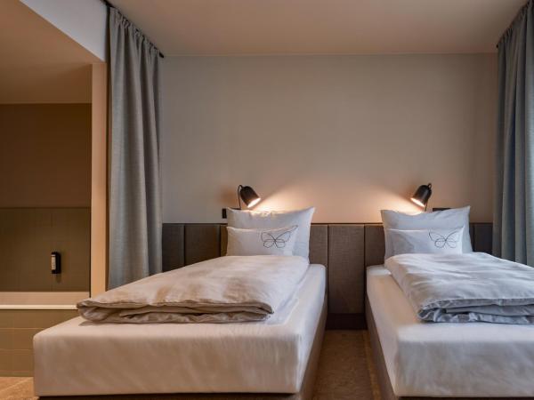 Cocoon Salzburg : photo 1 de la chambre chambre lits jumeaux avec baignoire (lits jumeaux)