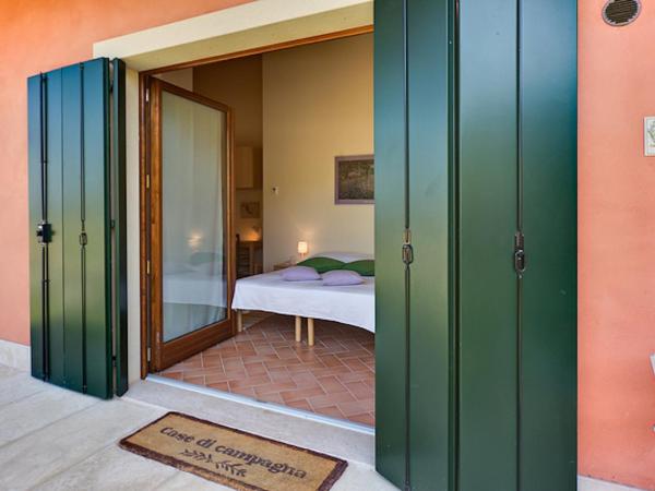 Agriturismo Il Pianetto : photo 2 de la chambre chambre double ou lits jumeaux - vue sur jardin