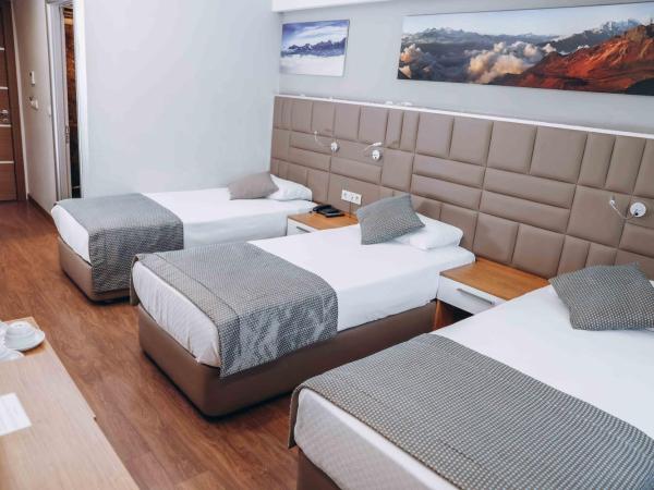 Hakcan Hotel : photo 4 de la chambre chambre triple