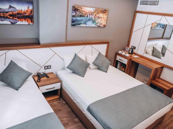 Hakcan Hotel : photo 10 de la chambre chambre triple