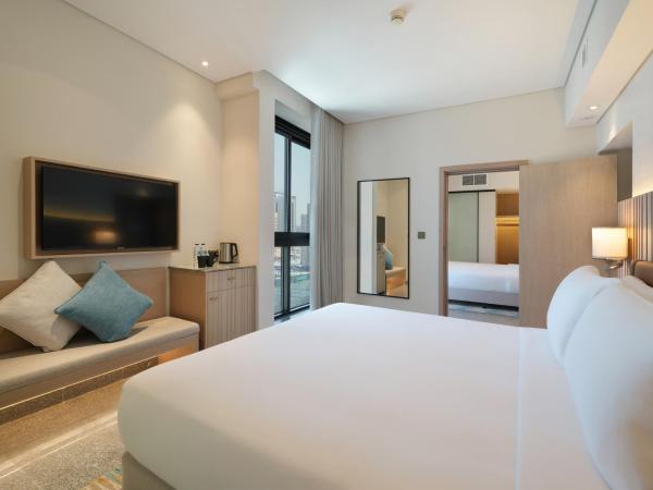 Arabian Park Dubai, an Edge by Rotana Hotel : photo 2 de la chambre chambres communicantes familiales avec lit king-size et lits jumeaux