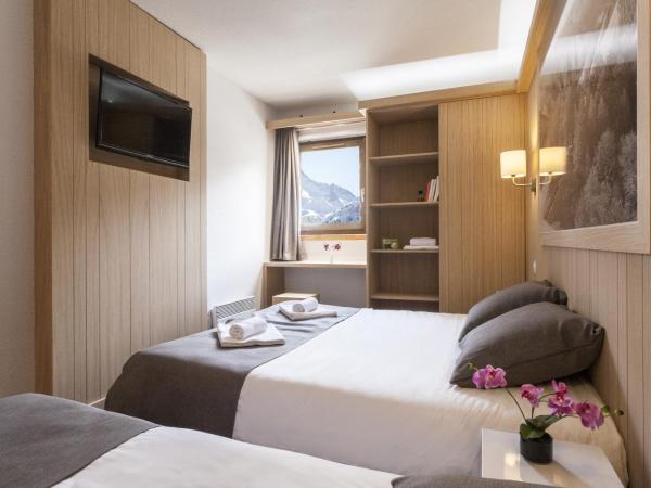 Hôtel Club mmv Les Arolles **** : photo 1 de la chambre chambre quadruple