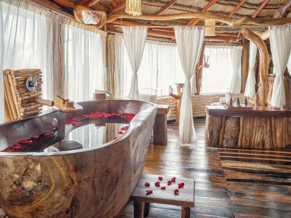 Kanan Tulum Treehouse, Rooftop, Beach Club & Spa - Adults Only : photo 6 de la chambre suite lit king-size signature arrondie - vue sur jardin