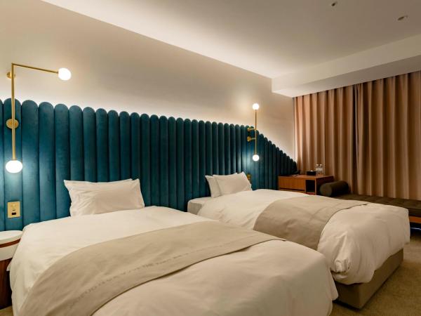 THE KNOT HIROSHIMA : photo 2 de la chambre chambre lits jumeaux supérieure - vue sur ville