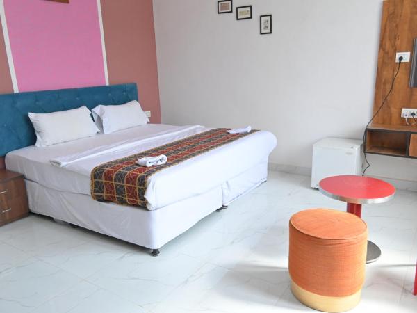 Hotel Apni Haveli : photo 4 de la chambre suite lit king-size avec balcon