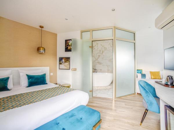 Queens Boutique Hotel : photo 1 de la chambre chambre triple avec balcon