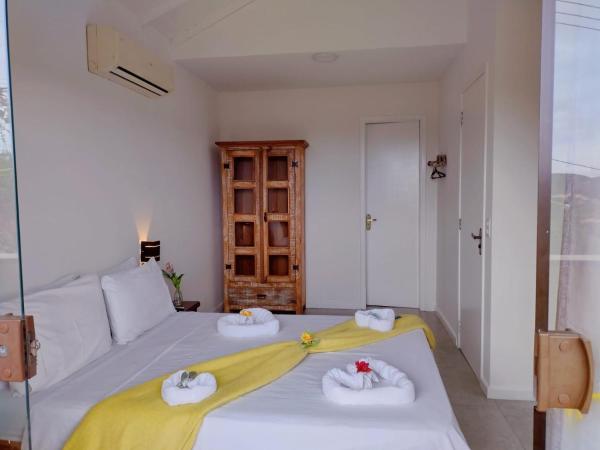 Pousada Mar'Tito Forno : photo 1 de la chambre chambre double avec patio