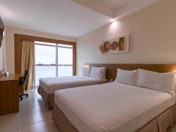 Praiamar Express Hotel : photo 4 de la chambre chambre supérieure avec 2 lits doubles - vue sur mer